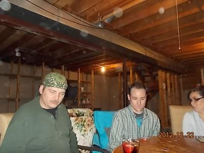 My sister took this picture while the family was playing poker and there are lots of orbs in the air around them.